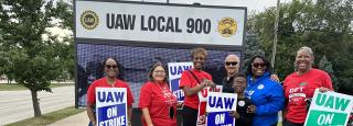 DFT Members Stand in Front of Local 900 UAW sign