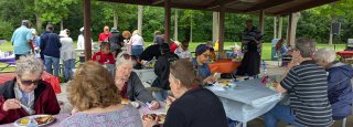 retirees enjoy BBQ lunch