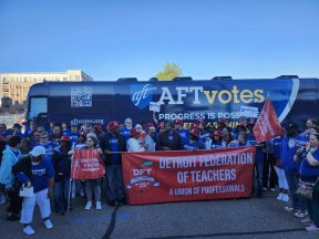 DFT stands in front of AFT bus